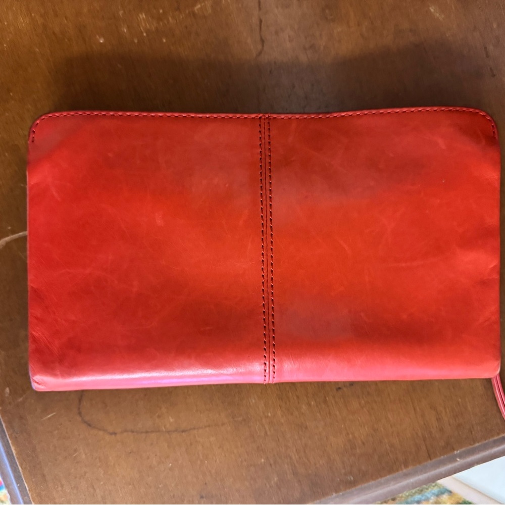 Butters soft orange wristlet.